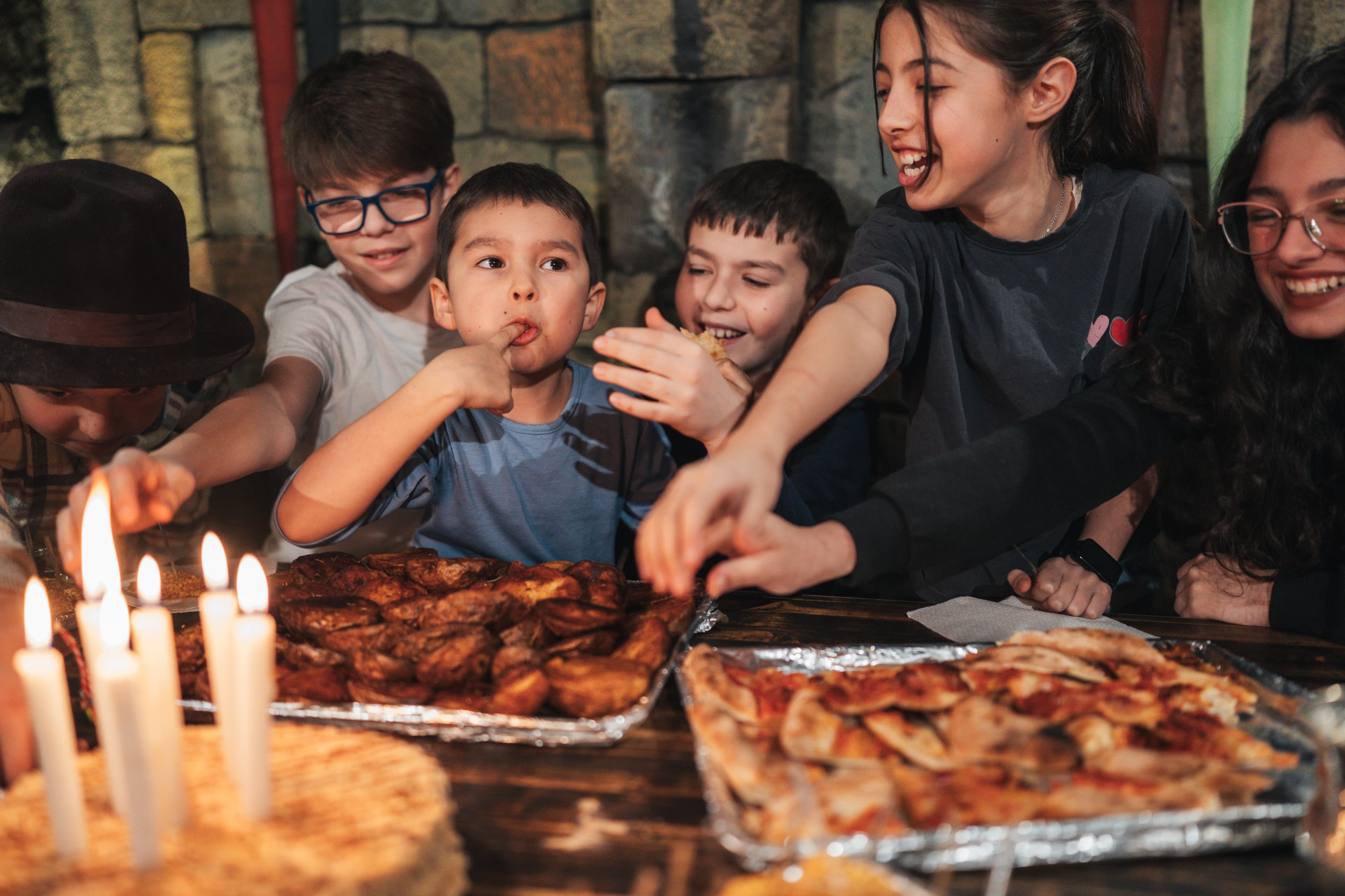 Laughing children around the party table